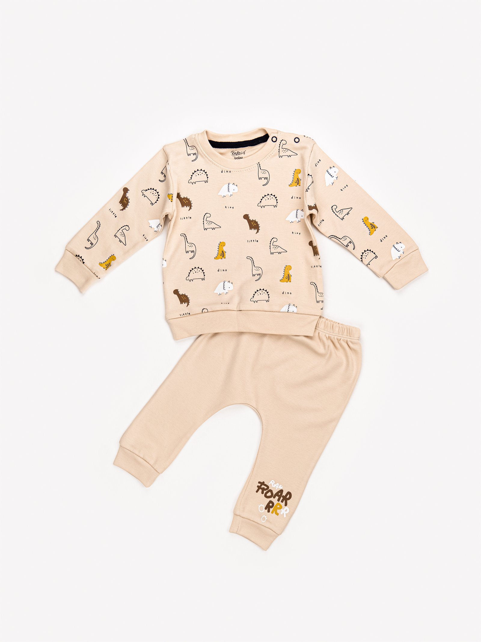 Ensemble beige avec motifs dinosaures pour bébé, représentant une des tendances mode bébé au Maroc en 2025 inspirée par l’univers ludique.
